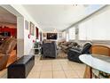 Spacious living area with tile floors, lots of natural light, and comfortable furniture at 2504 Caribbean Ct, Orlando, FL 32805