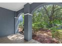 Relaxing covered patio with views of mature trees and lush greenery at 3561 Conroy Rd # 216, Orlando, FL 32839