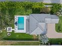 An aerial view showcases the property's pool, patio, and lush landscaping at 3865 W Stillwood Ln, Lake Mary, FL 32746