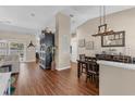 An open floor plan featuring beautiful wood floors, neutral paint, and lots of natural light throughout at 445 Oakland Park Blvd, Port Orange, FL 32127