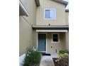 Charming townhome featuring a teal-painted front door at 626 Old Pine Ct, Sanford, FL 32773