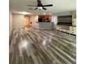 Open-concept living area with wood-look flooring, perfect for entertaining at 626 Old Pine Ct, Sanford, FL 32773