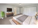 Spacious bedroom with ample closet space, stylish dresser, and ensuite bathroom access at 10350 Sw 62Nd Terrace Rd, Ocala, FL 34476
