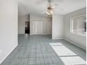 Spacious and well-lit living room with vaulted ceilings and abundant natural light at 10350 Sw 62Nd Terrace Rd, Ocala, FL 34476