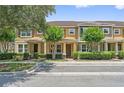 Inviting exterior with lush landscaping, covered entry, and a well-manicured lawn at 11213 Grander Dr, Windermere, FL 34786