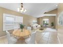 Bright living room with natural light from large window, dining table and plush seating at 14780 Hartford Run Dr, Orlando, FL 32828