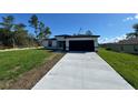 Charming single-story home boasts a concrete driveway and a two-car garage at 2336 Sw 168Th Loop, Ocala, FL 34473