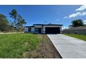 Charming single-story home boasts a concrete driveway and a two-car garage at 2336 Sw 168Th Loop, Ocala, FL 34473