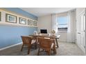 Bright office space with modern decor and neutral tones, ideal for remote work at 3326 Arch Ave, Ormond Beach, FL 32174
