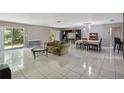 Open living room with lots of floor space, a tile floor, and natural lighting at 4806 Gallant Ln, Orlando, FL 32821