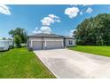 Beautifully designed single-story home with three-car garage and a spacious driveway, perfect for families at 506 Marion Oaks Trl, Ocala, FL 34473