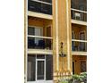 Exterior facade displaying the building number and balconies on a three story building at 5291 Images Cir # 301, Kissimmee, FL 34746