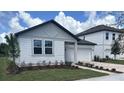 Charming single-story home with a brick driveway and well-maintained landscaping at 706 Junonia Blvd, New Smyrna Beach, FL 32168