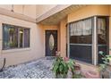 Inviting entryway with decorative door and potted plants at 1085 Island Way, Leesburg, FL 34748