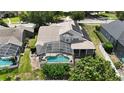 Aerial view of the home featuring a screened-in pool and backyard at 1201 Shelter Rock Rd, Orlando, FL 32835
