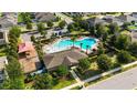 Aerial view of community pool, playground, and clubhouse; a great place to relax and play at 1265 Blarney St, Minneola, FL 34715