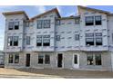 Townhome construction featuring multiple windows and sturdy block foundation protected with Typar weather-resistant wrap at 15465 Hamlin Park Drive, Winter Garden, FL 34787
