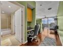 Modern office space in condominium with hardwood floors and city views at 155 S Court Ave # 1909, Orlando, FL 32801