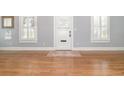 Bright living room with hardwood floors, fresh paint and shuttered windows at 338 E Anderson St, Orlando, FL 32801