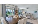 Open-concept dining area with luxury finishes and seamless access to outdoor space at 1217 Reunion Village Blvd, Kissimmee, FL 34746