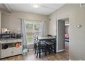 Bright dining area with a view of the backyard, adjacent to the kitchen and living spaces at 1301 Lawne Blvd, Orlando, FL 32808