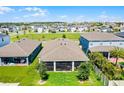Birds eye view of screened patio and fenced backyard at 2223 Blue Salvia St, Clermont, FL 34711
