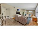 Bright living room with tile flooring, stylish furnishings, and modern decor, ideal for relaxing or entertaining at 2524 Sweetwater Trl, Winter Park, FL 32789