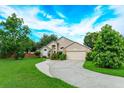 Traditional single-Gathering home with a curved driveway and mature landscaping at 300 Churchill Dr, Longwood, FL 32779