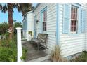Inviting exterior detail showcasing a bench on the porch and charming architectural elements at 330 Phoenix Ave, Daytona Beach, FL 32118