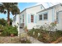Detailed view of the exterior with light blue trim outlining the windows and siding at 330 Phoenix Ave, Daytona Beach, FL 32118