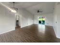 Spacious living room featuring new flooring and sliding glass doors to the backyard at 3321 Crimson Ln, Deltona, FL 32738