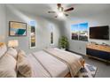 Serene bedroom with natural light, modern decor, and stylish ceiling fan at 3321 Crimson Ln, Deltona, FL 32738