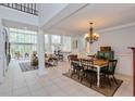 Open-concept dining area flowing into the kitchen and living room at 334 N Shadowbay Blvd, Longwood, FL 32779