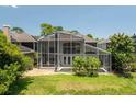 An enclosed pool and outdoor living space with a view of the water at 334 N Shadowbay Blvd, Longwood, FL 32779