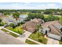 Beautiful home with lush landscaping near a serene lake in a desirable neighborhood at 4249 Andover Cay Blvd, Orlando, FL 32825