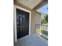 Unit 1921 has a clean black front door with a white trim and a gray concrete entry area at 4704 Walden Cir # 21, Orlando, FL 32811