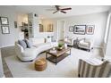 Bright living room features modern furnishings and an open floor plan to the kitchen at 4704 Walden Cir # 21, Orlando, FL 32811