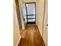 Inviting foyer with wood-look floors and convenient coat closet at 650 Woodridge Drive, Fern Park, FL 32730
