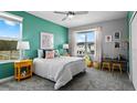 Cozy bedroom with bright wall, large windows, and comfortable furnishings at 7876 Marlow Pl, Kissimmee, FL 34746