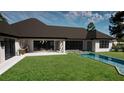 Inviting backyard with a small pool, covered patio, and lush green lawn perfect for outdoor entertaining at 9940 Black Bear Ln, Winter Garden, FL 34787