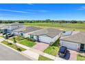 An aerial view of the property showcasing the surrounding neighborhood and green spaces at 1127 Foreshore Ln, Haines City, FL 33844