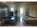 Fun game room with ping pong table, pool table and natural light at 120 Terrace Ridge Cir # 120, Davenport, FL 33896