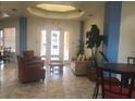 Inviting lobby with comfortable seating, tile floors, and natural light at 120 Terrace Ridge Cir # 120, Davenport, FL 33896
