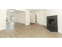 Bright living room with modern flooring, fireplace, and open layout at 1204 Duncan Ct, Longwood, FL 32779