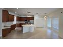 Spacious eat-in kitchen with stainless steel appliances, center island, and lots of storage space at 12126 Diedra Ct, Orlando, FL 32825
