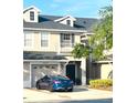 Two-story home boasting attached garage, well-manicured landscaping, and neutral color scheme in desirable community at 14033 Turning Leaf Dr, Orlando, FL 32828