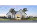 Beautiful new community clubhouse with stunning modern farmhouse architecture and professional landscaping at 1828 Crowncrest Dr, Apopka, FL 32703