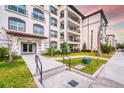 Condominium building with well-maintained landscaping, a welcoming entrance, and convenient access for residents at 4013 Breakview Dr # A407, Orlando, FL 32819
