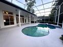 Inviting screened-in pool area perfect for relaxation with its refreshing blue water and spacious deck at 460 W Palm Valley Dr, Oviedo, FL 32765