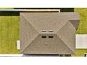 Aerial view of a well-maintained roof with a symmetrical design and efficient drainage at 5857 Beefmaster Rd, St Cloud, FL 34771